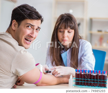 Patient during blood test sampling procedure taken for analysis Patient during blood test sampling procedure taken for analysis 74985203