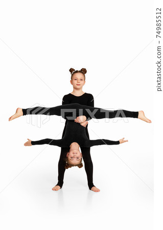 two gymnast child girls show athletic skills two gymnast child girls show athletic skills 74985512