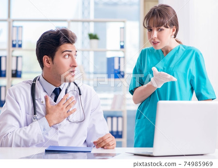 Doctor angry at his assistant due to medical error Doctor angry at his assistant due to medical error 74985969