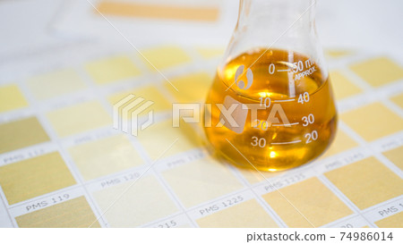A flask with urine. Medical analyzes concept. Diagnostics by the color of urine 74986014