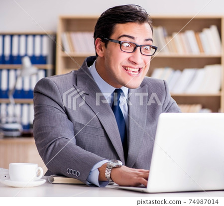 Funny businessman in the office 74987014