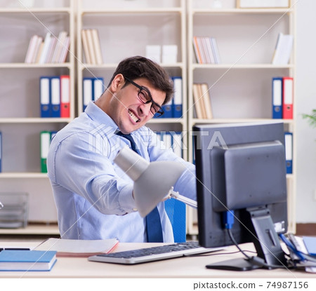 Angry businessman frustrated with too much work Angry businessman frustrated with too much work 74987156