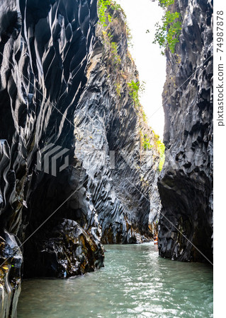 Basalt rocks and pristine water of Alcantara gorges in Sicily, Italy Basalt rocks and pristine water of Alcantara gorges in Sicily, Italy 74987878