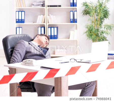 Dead businessman at this desk Dead businessman at this desk 74988041