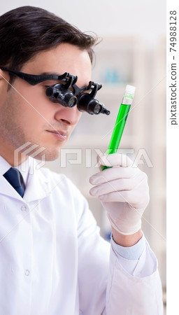 Chemist working on cannabis extract for medical purposes Chemist working on cannabis extract for medical purposes 74988128
