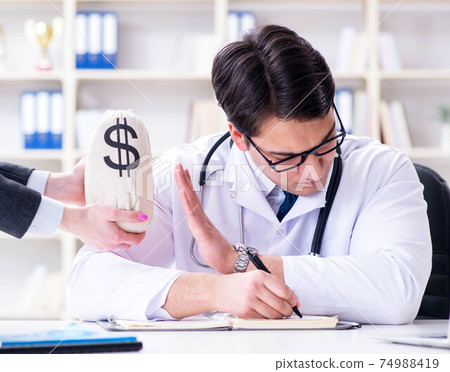 Young doctor in medical insurance fraud concept 74988419