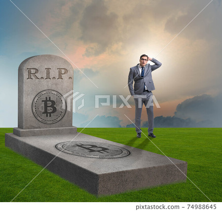 Businessman mourning the demise and death of bitcoin Businessman mourning the demise and death of bitcoin 74988645