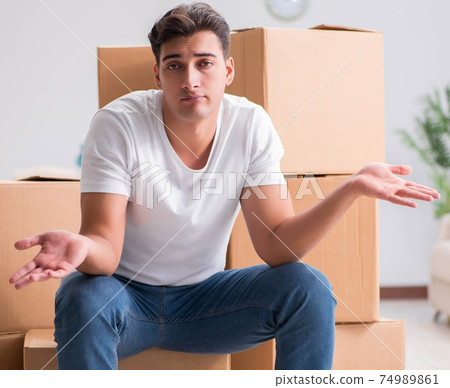 Man caryying boxes at home Man caryying boxes at home 74989861