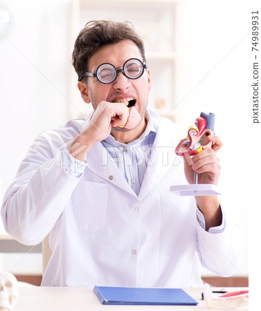 Crazy doctor with heart model 74989931