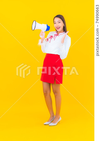 Portrait beautiful young asian woman use megaphone Portrait beautiful young asian woman use megaphone 74990663