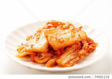 Chinese cabbage kimchi on a small plate. (White background) 74991128