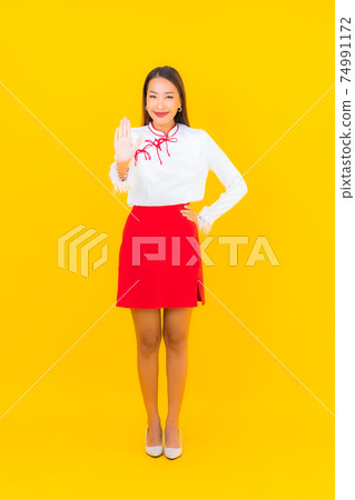 Portrait beautiful young asian woman smile in action Portrait beautiful young asian woman smile in action 74991172