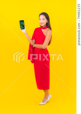 Portrait beautiful young asian woman with smart mobile phone with credit card Portrait beautiful young asian woman with smart mobile phone with credit card 74991235
