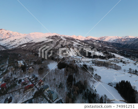 Panorama photo of the beautiful Mt. Hakuba Morgenroth and Happoone Ski Resort Hakuba Village, Nagano Prefecture (aerial view by drone) 74991251