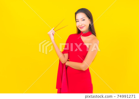 Portrait beautiful young asian woman with chopstick Portrait beautiful young asian woman with chopstick 74991271