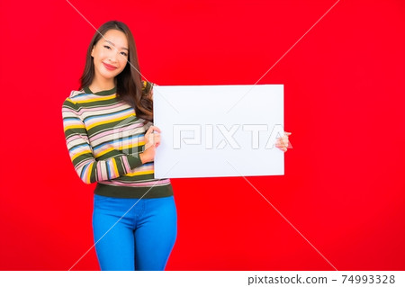 Portrait beautiful young asian woman with white empty billboard 74993328