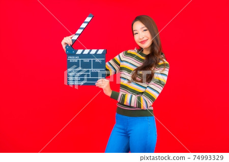 Portrait beautiful young asian woman with movie slate cutting 74993329