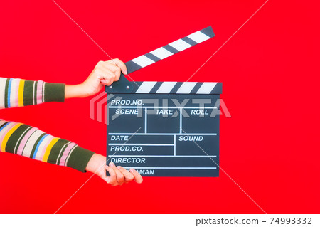 Portrait beautiful young asian woman with movie slate cutting Portrait beautiful young asian woman with movie slate cutting 74993332