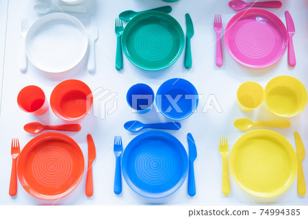 Top view of a plastic crockery set on a white background Top view of a plastic crockery set on a white background 74994385