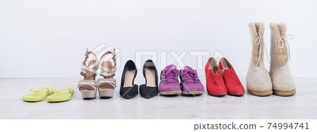 Women's footwear collection for any weather and all seasons. A row of women's shoes 74994741