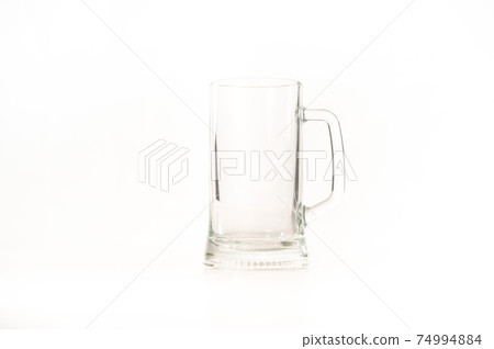 Empty beer glass on a white background. Copy space 74994884