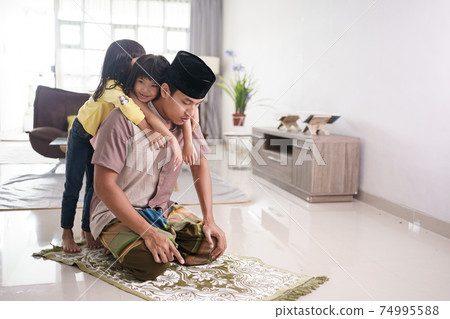 muslim father being disturbed by his daugther muslim father being disturbed by his daugther 74995588