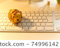 Keyboard and piggy bank Keyboard and piggy bank 74996142