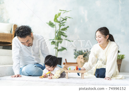 11 month old baby playing with wooden toys 74996152