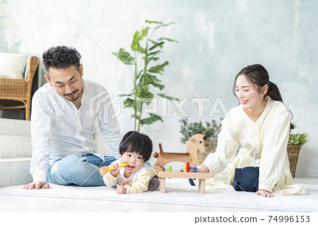 11 month old baby playing with wooden toys 74996153