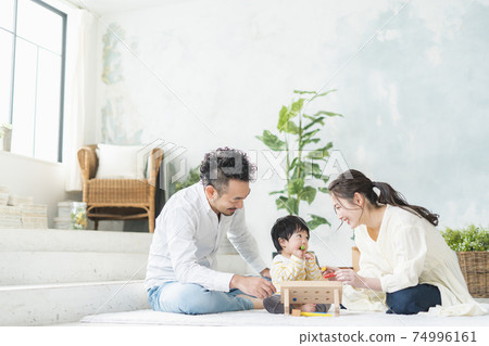 11 month old baby playing with wooden toys 74996161