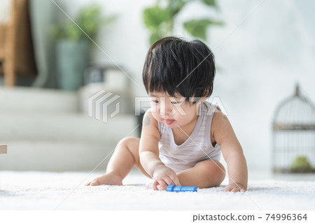 0 year old baby playing with wooden toys 0 year old baby playing with wooden toys 74996364