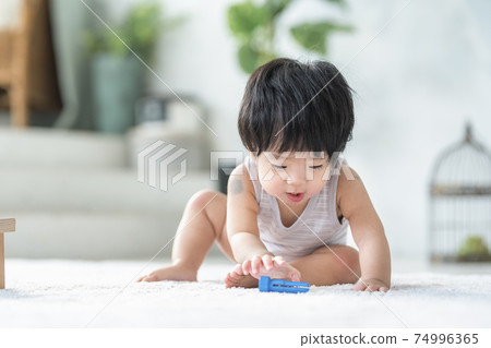 0 year old baby playing with wooden toys 0 year old baby playing with wooden toys 74996365