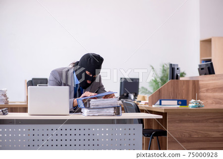 Young male employee in industrial espionage concept Young male employee in industrial espionage concept 75000928