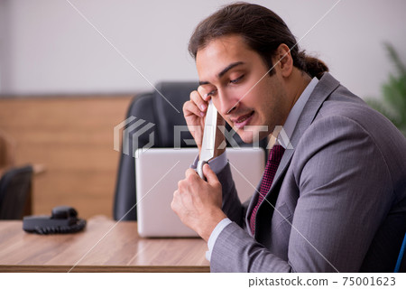 Young businessman employee in bullying concept in the office 75001623