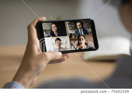Close up of woman talk on video call with colleagues Close up of woman talk on video call with colleagues 75002589