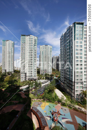 Blue sky and apartment complex, 75008508