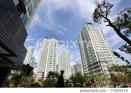 Blue sky and apartment complex, 75008514