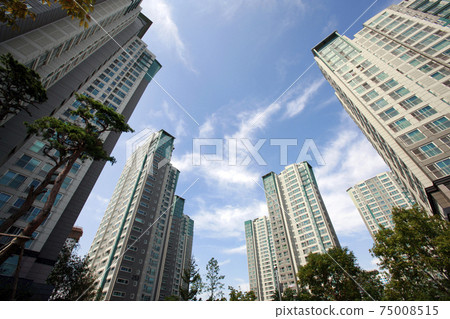 Blue sky and apartment complex, 75008515