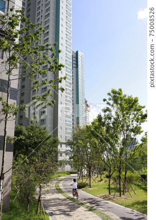 Blue sky and apartment complex, 75008526