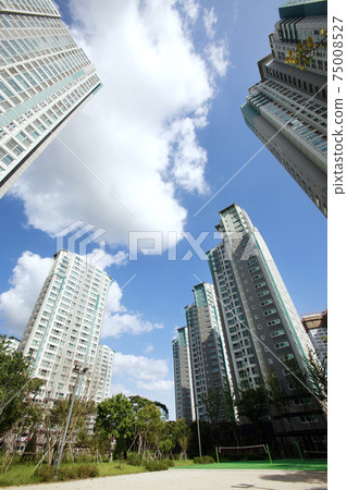 Blue sky and apartment complex, 75008527