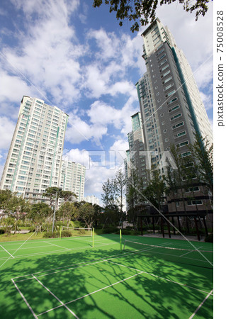 Blue sky and apartment complex, 75008528