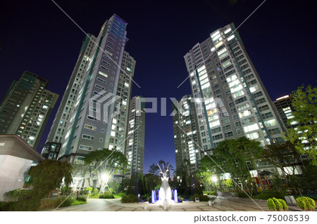 Blue sky and apartment complex, 75008539