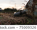 Rusted machine left in the field 75009326