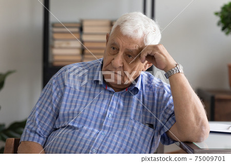 Head shot unhappy depressed mature man lost in thoughts Head shot unhappy depressed mature man lost in thoughts 75009701