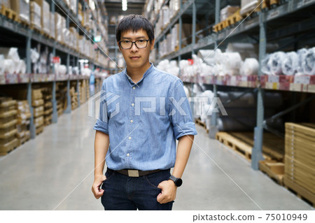 Portrait Asian men, staff, product counting Warehouse Control Manager Standing, counting and inspecting products in the warehouse Portrait Asian men, staff, product counting Warehouse Control Manager Standing, counting and inspecting products in the warehouse 75010949