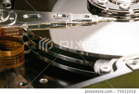 Computer hard drive reading head. Opened hard disk from personal computer 75011018