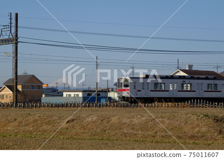 Koedo Kawagoe: A train runs through the Tobu-Tojo Line with Mt. Fuji in the background Koedo Kawagoe: A train runs through the Tobu-Tojo Line with Mt. Fuji in the background 75011607