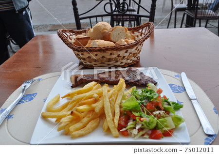 Steak set served at a restaurant in Morocco (Tangier) Steak set served at a restaurant in Morocco (Tangier) 75012011