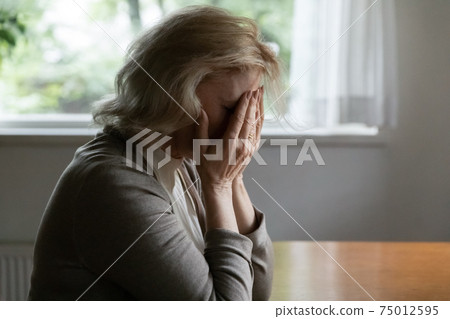 Depressed mature OAP 60s woman going through crisis Depressed mature OAP 60s woman going through crisis 75012595