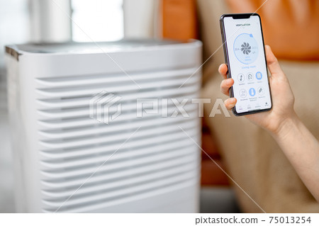 Smartphone with launched application for ventilation adjustment Smartphone with launched application for ventilation adjustment 75013254